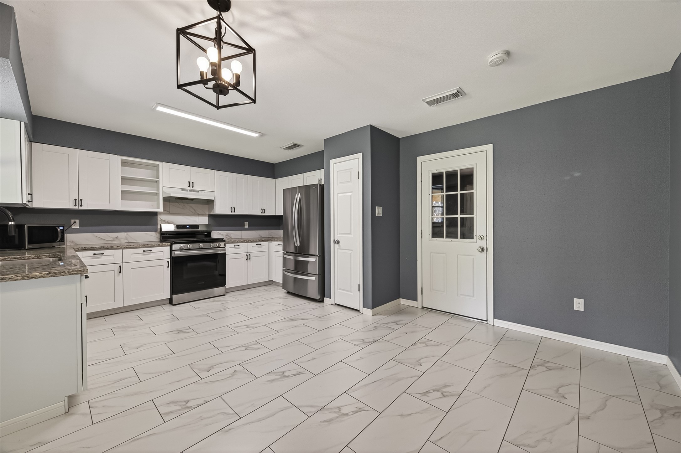 24006 Lone Elm Drive Spring, TX 77373 - Photo 5 of 25 Kitchen with space for a small breakfast table and comes with fridge!