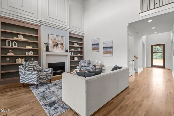 a view of a room with wooden floor