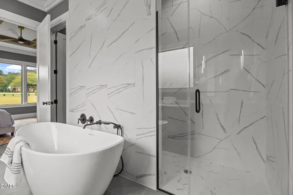 a bedroom with a bed and a view of bathroom