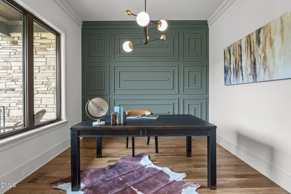 a view of a hallway with wooden floor and closet