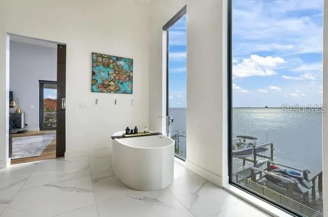 a view of a room with shelves and entryway