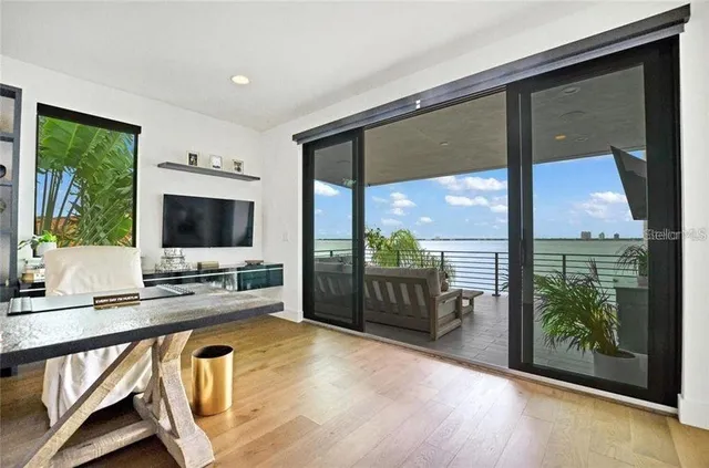 a room with furniture and flat screen tv