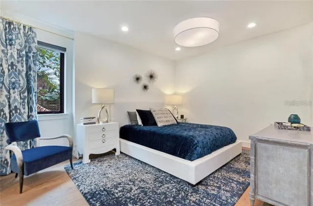 a bedroom with a bed and a couch