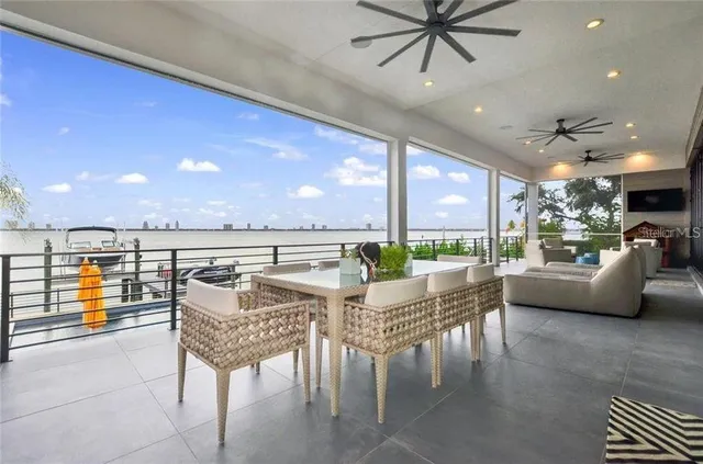 a living room with furniture and a view of kitchen