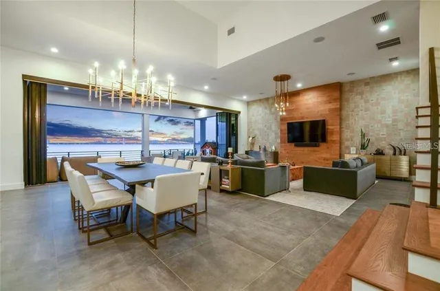 a large kitchen with a table and chairs