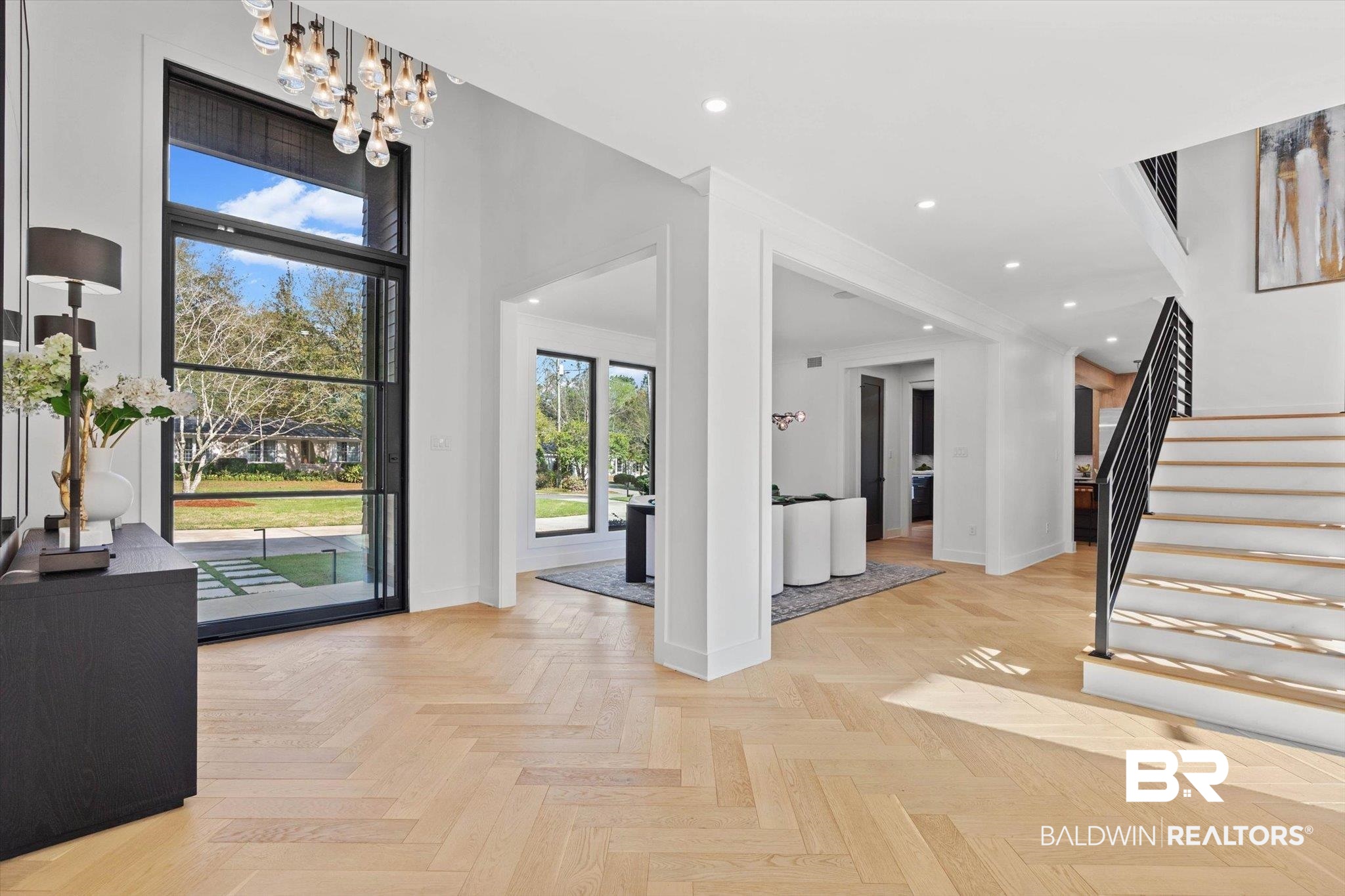 69 Jordan Lane Mobile, AL 36608 - Photo 3 of 57 Foyer entrance featuring parquet flooring and suspended lighting