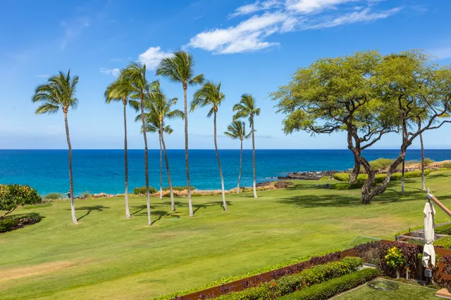 a view of a swimming pool with a table and chairs