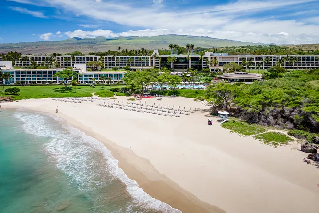 a view of a city with tall buildings in the background