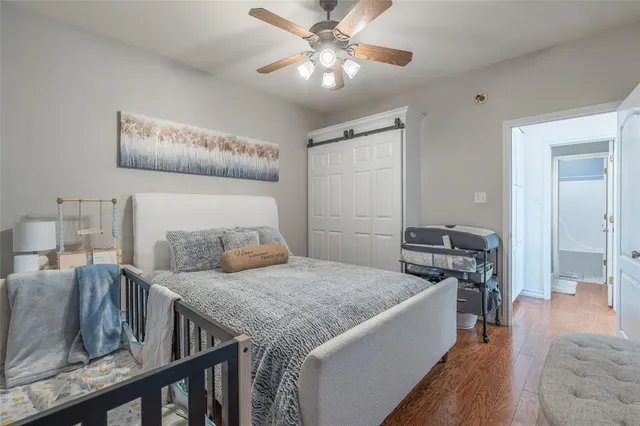 a bedroom with furniture and a chandelier