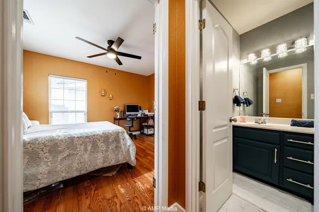 a bedroom with a bed and a dresser