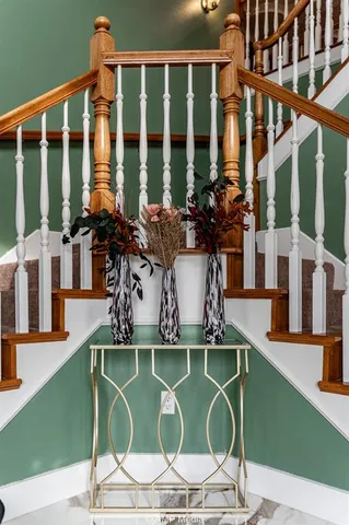 a house view with a swimming pool table and chairs
