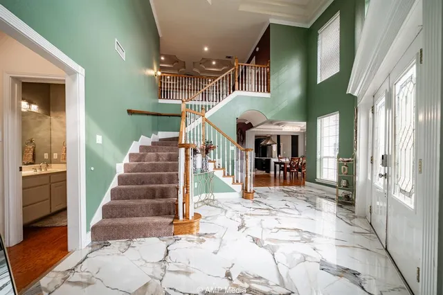 a view of a building with stairs and a porch