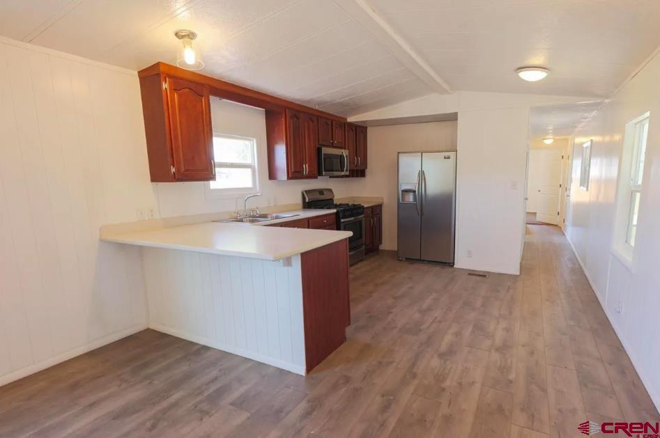 11 Rickey Place Monte Vista, CO 81144 - Photo 11 of 16 a kitchen with a refrigerator and a sink
