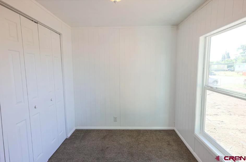 11 Rickey Place Monte Vista, CO 81144 - Photo 4 of 16 a view of an empty room and window