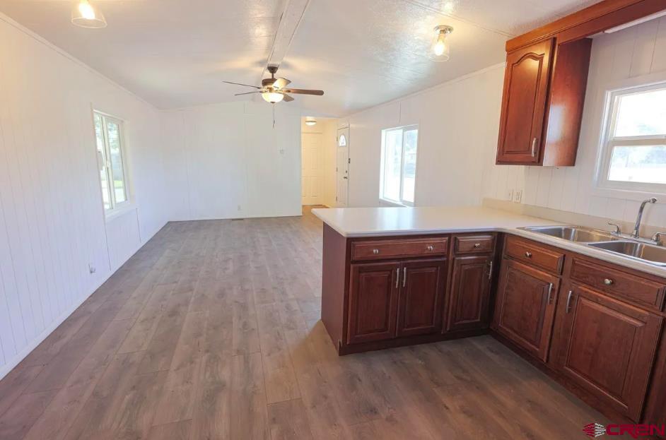11 Rickey Place Monte Vista, CO 81144 - Photo 5 of 16 a kitchen with a sink a window and cabinets