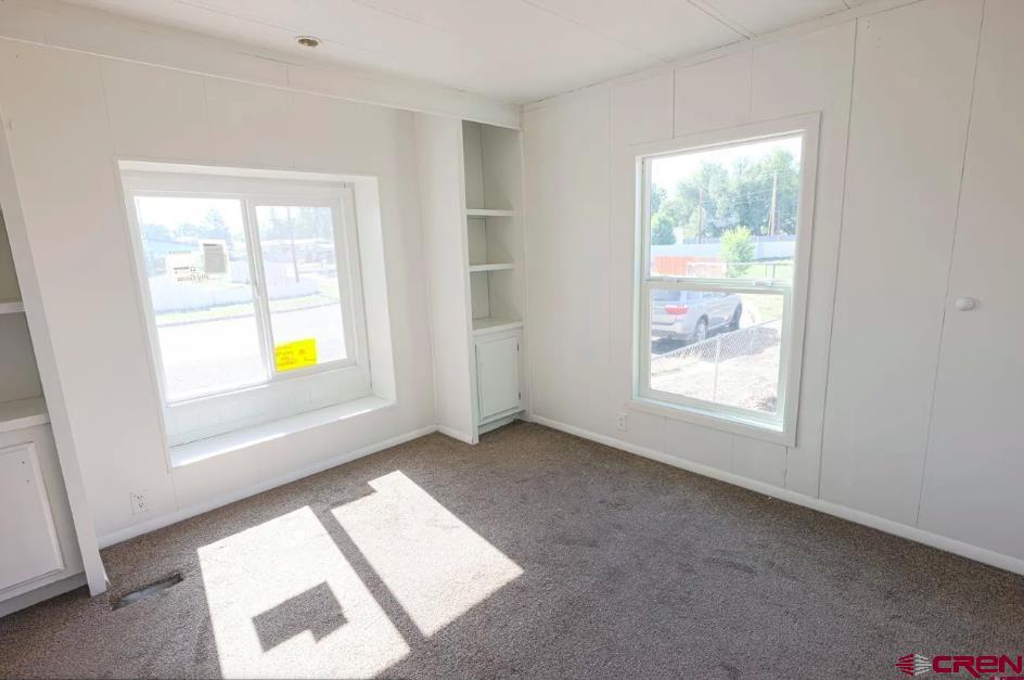 11 Rickey Place Monte Vista, CO 81144 - Photo 6 of 16 an empty room with windows