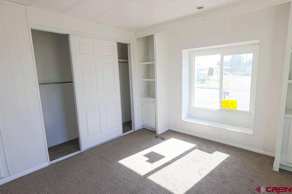 11 Rickey Place Monte Vista, CO 81144 - Photo 7 of 16 a view of an empty room and window