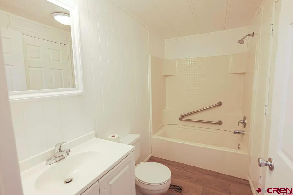 11 Rickey Place Monte Vista, CO 81144 - Photo 8 of 16 a bathroom with a sink toilet and shower
