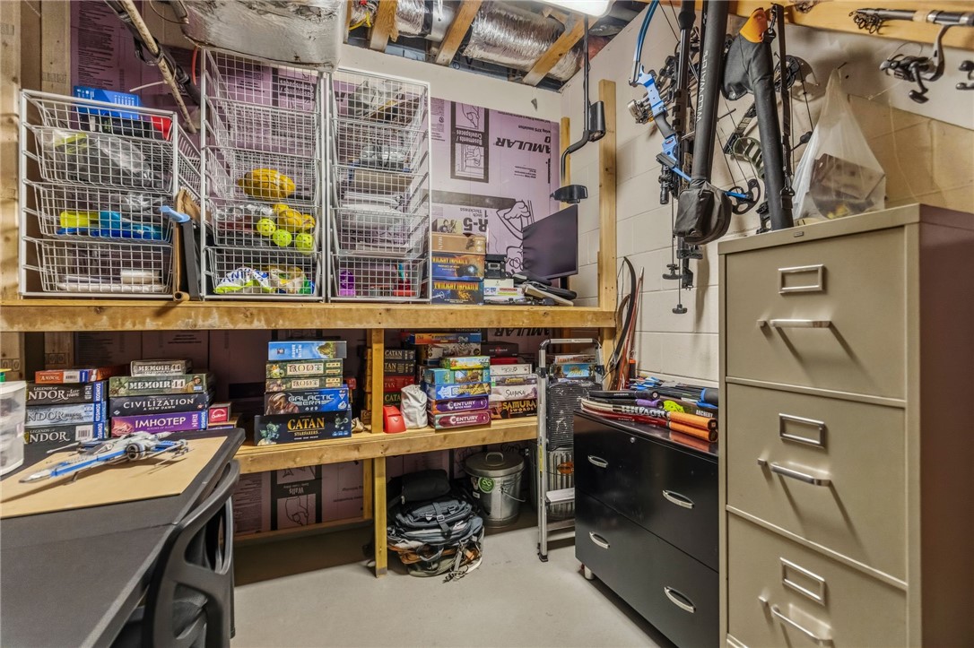 641 Lands End Road Seneca, SC 29678 - Photo 24 of 39 A well-organized utility space features ample built-in storage shelves and practical filing cabinets, perfect for diverse needs.