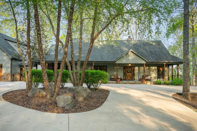 a view of a patio with a dining table and chairs