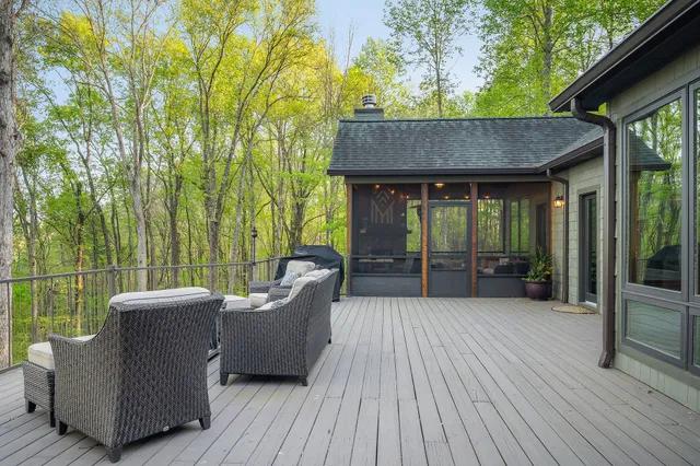 a kitchen with stainless steel appliances granite countertop a stove and white cabinets next to a window