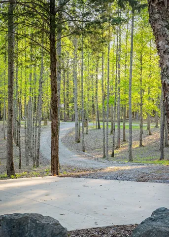 a view of a room with gym equipment and a large window