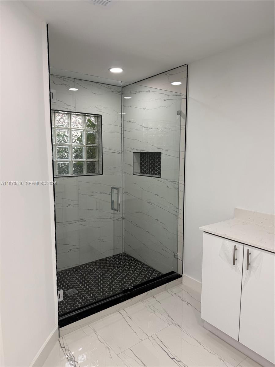 15921 Southwest 82nd Street Miami, FL 33193 - Photo 16 of 20 a bathroom with a shower