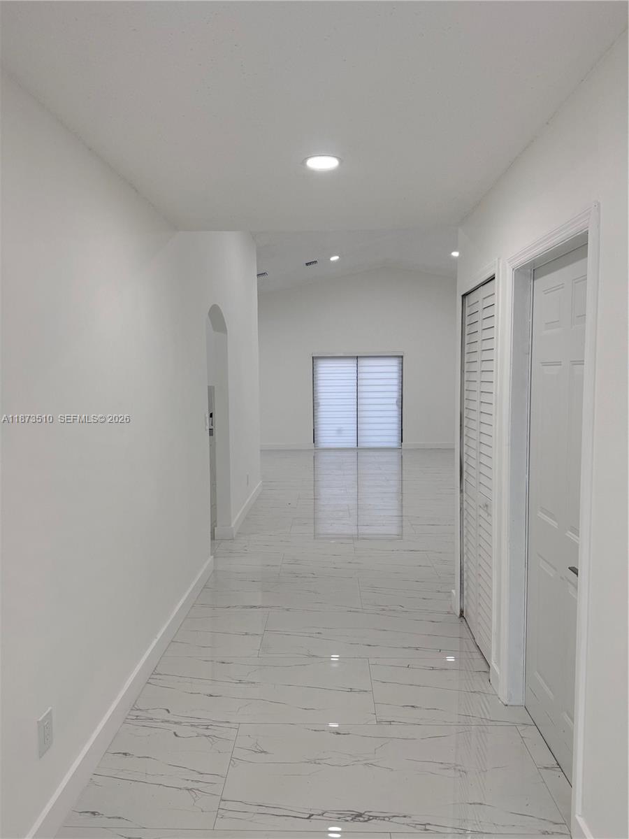 15921 Southwest 82nd Street Miami, FL 33193 - Photo 5 of 20 a view of a livingroom with an empty space and a window