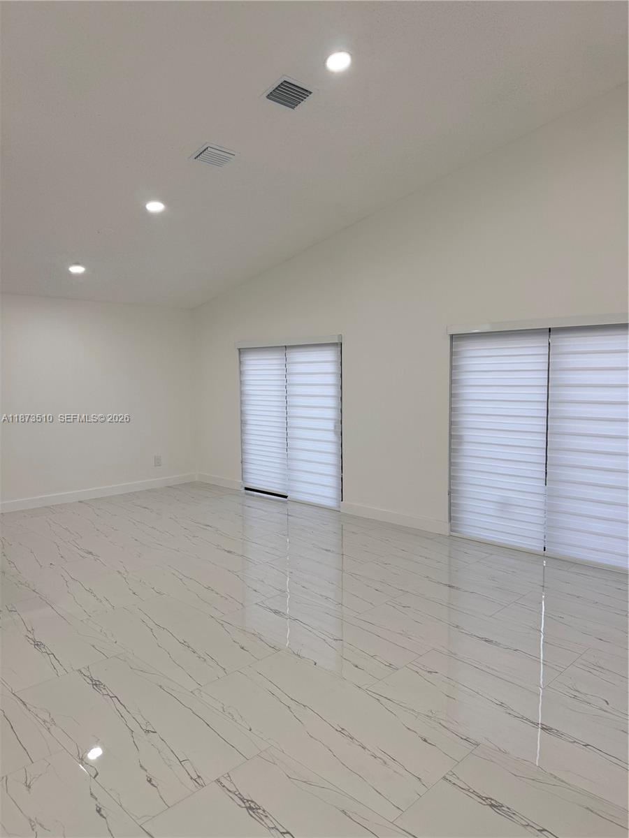 15921 Southwest 82nd Street Miami, FL 33193 - Photo 7 of 20 a view of an empty room with a window