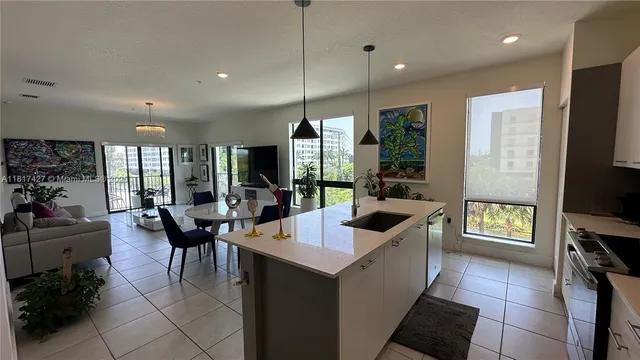 a dining room with furniture and a flat screen tv