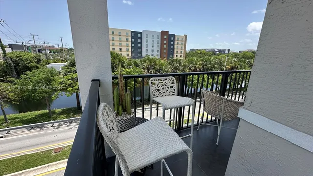 a lobby with furniture and a chandelier