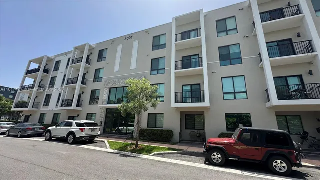 a lobby with furniture and floor to ceiling window