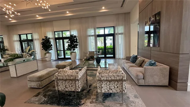 a lobby with a large mirror and furniture
