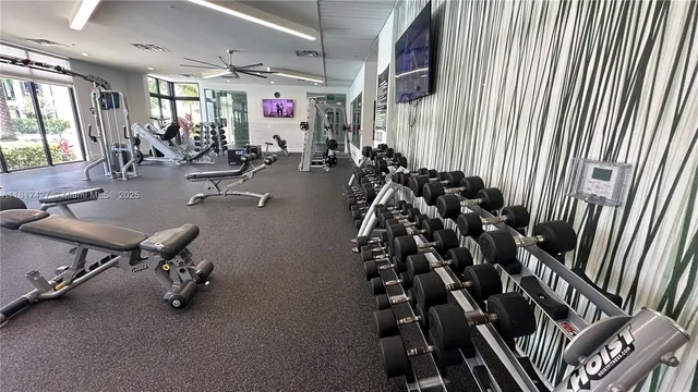 a view of a building with a yard and potted plants