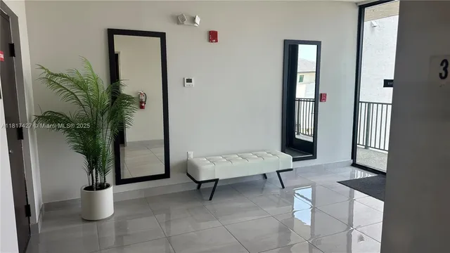 view of hall way with mirror