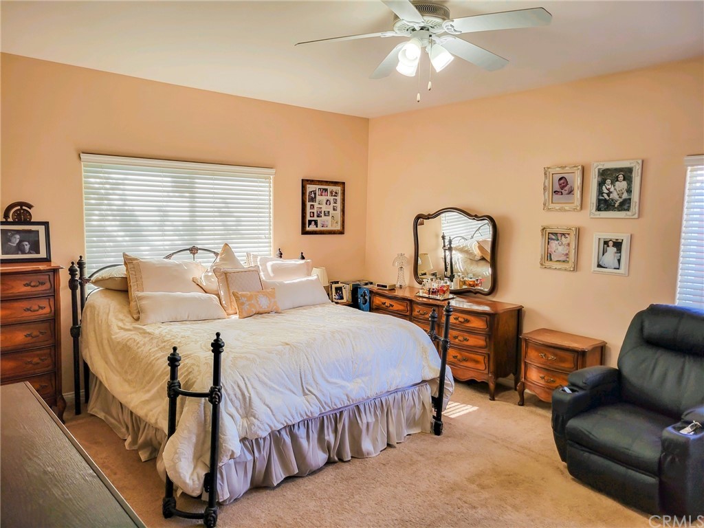 17157 Gamble Avenue Riverside, CA 92504 - Photo 5 of 11 a bedroom with a bed and wooden floor