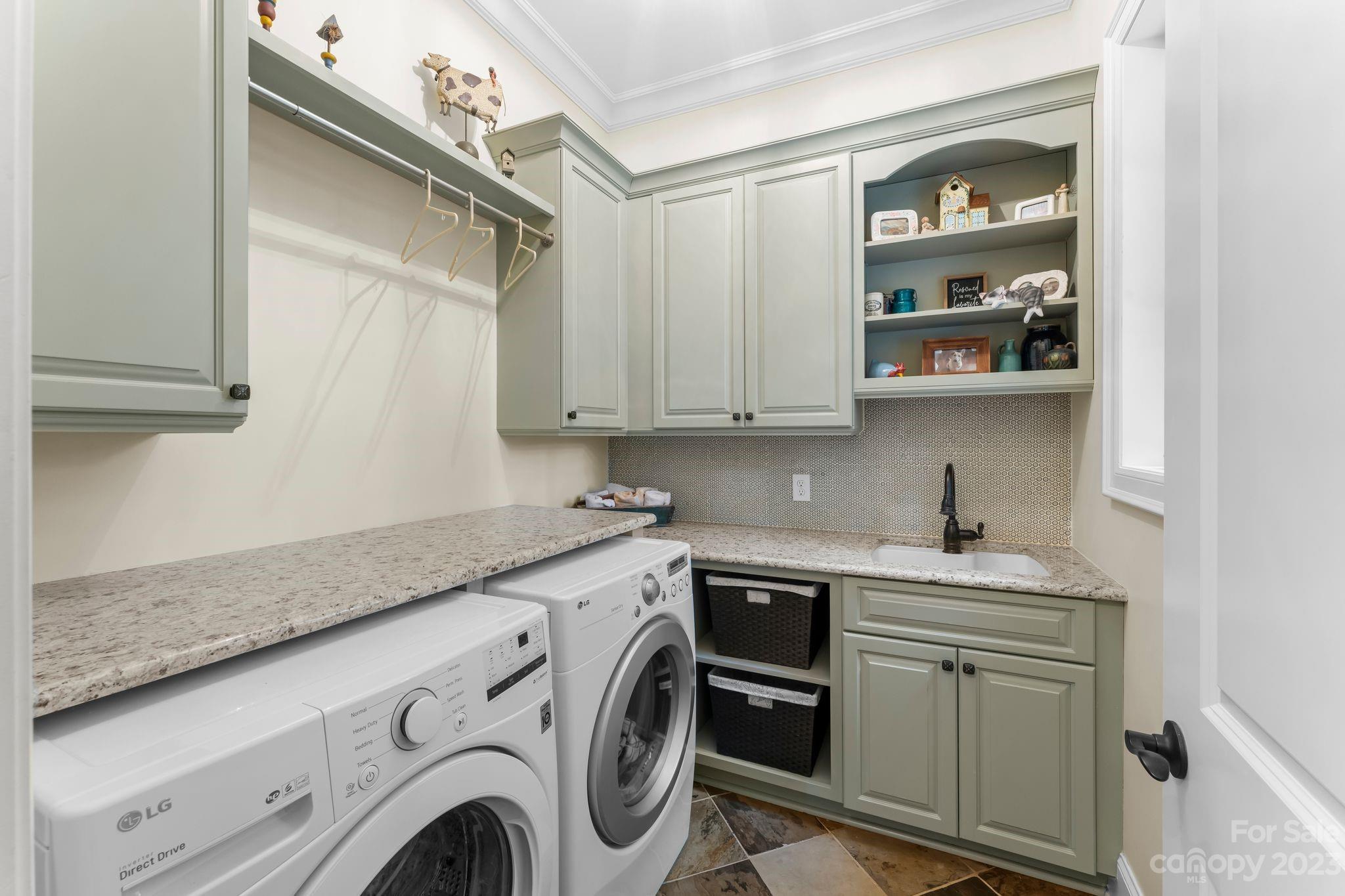 413 Bay Harbour Road Mooresville, NC 28117 - Photo 14 of 47 a utility room with stainless steel appliances granite countertop a sink and a washer dryer