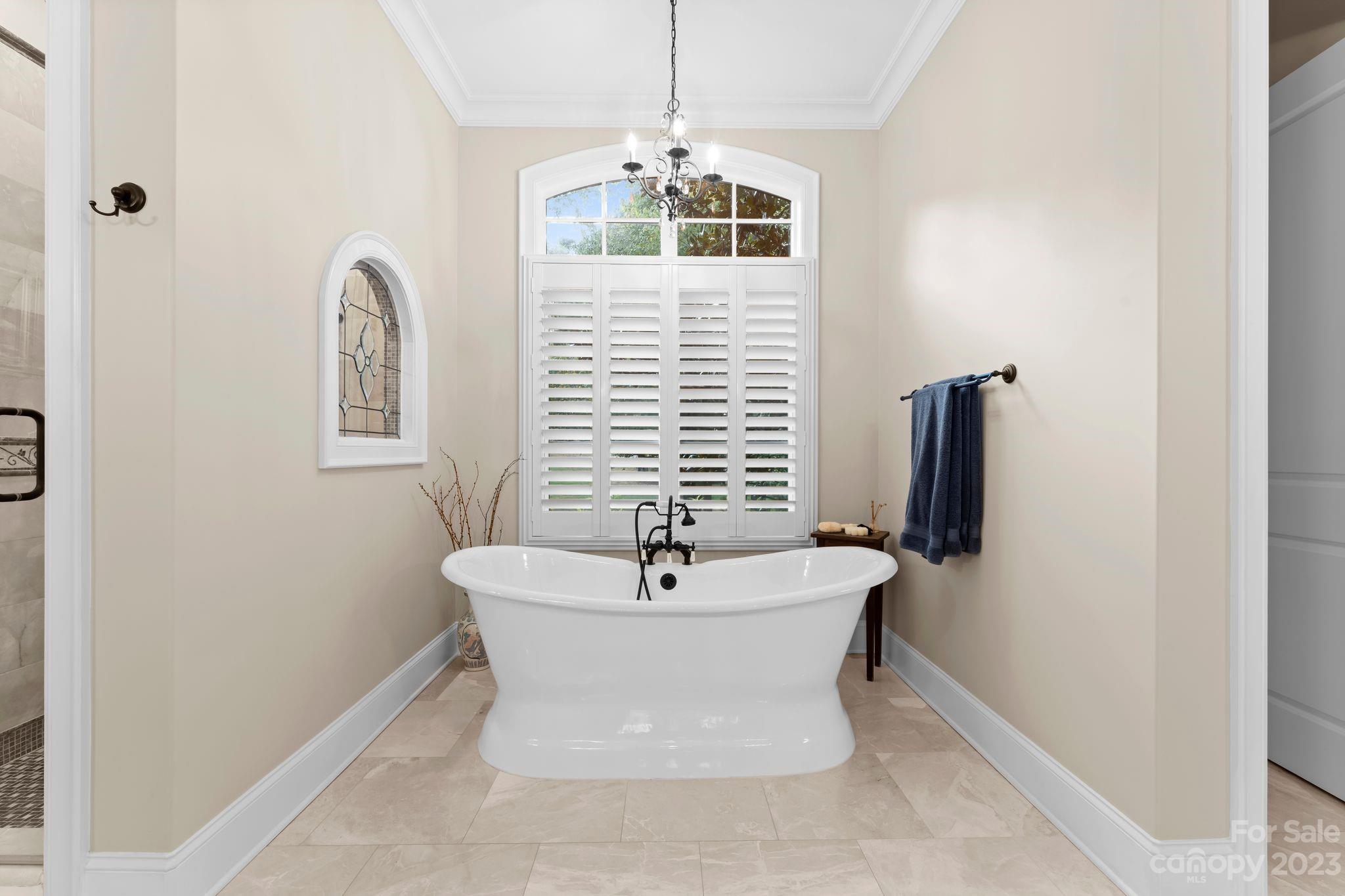 413 Bay Harbour Road Mooresville, NC 28117 - Photo 20 of 47 a bathroom with a sink and mirror with bathtub