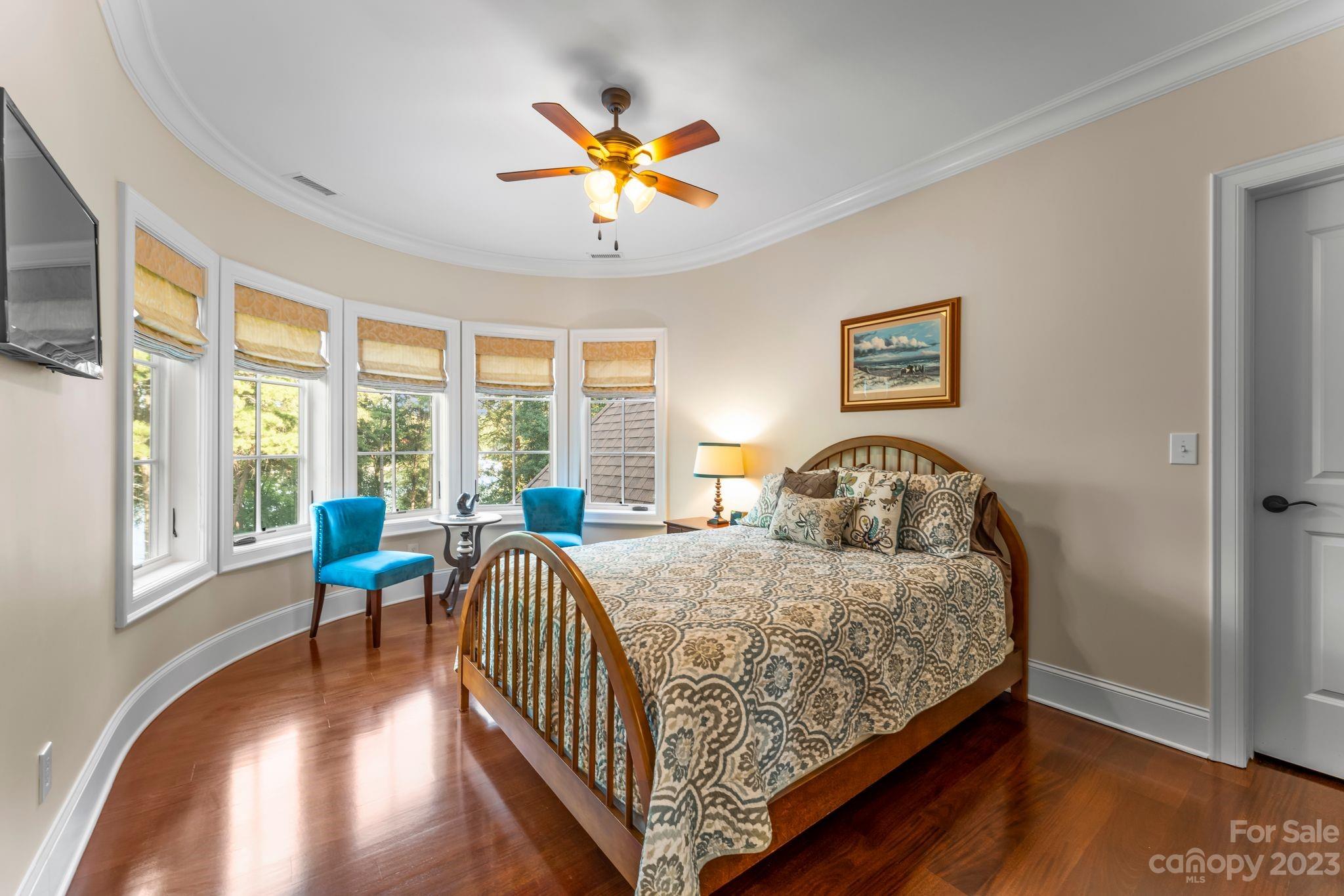 413 Bay Harbour Road Mooresville, NC 28117 - Photo 24 of 47 a bed room with a bed and a chandelier