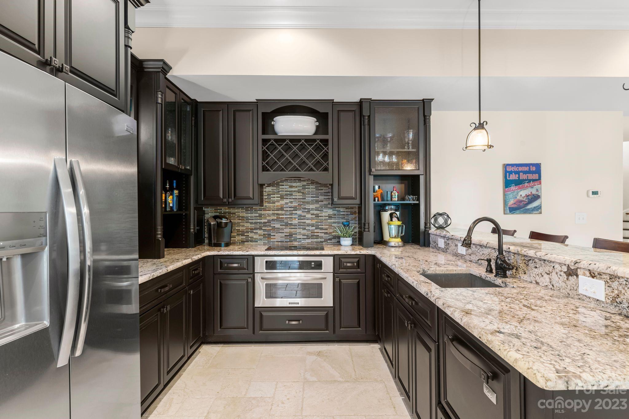 413 Bay Harbour Road Mooresville, NC 28117 - Photo 29 of 47 a kitchen with stainless steel appliances granite countertop a sink a stove and refrigerator