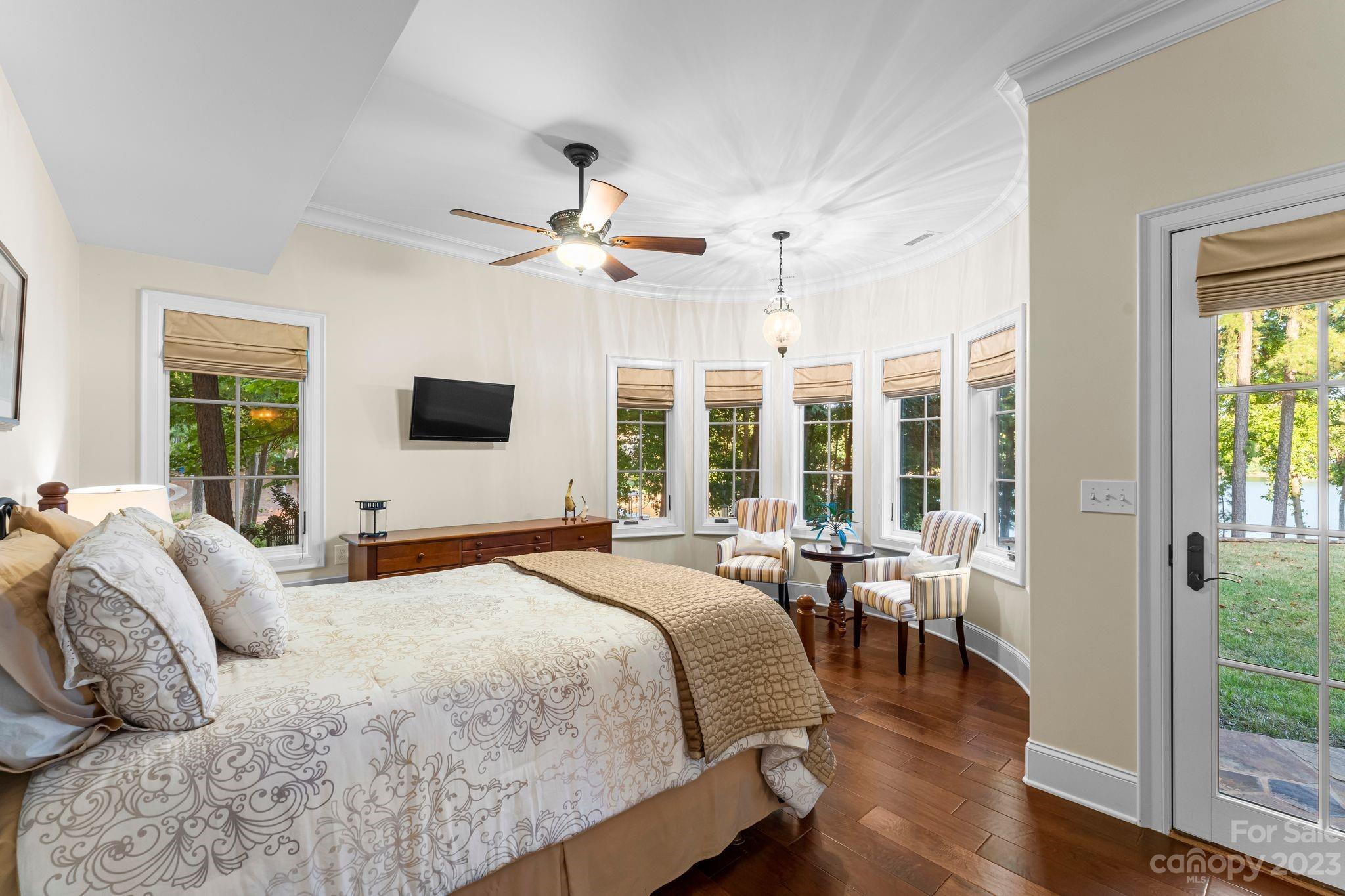 413 Bay Harbour Road Mooresville, NC 28117 - Photo 32 of 47 a bedroom with a large bed and a large window