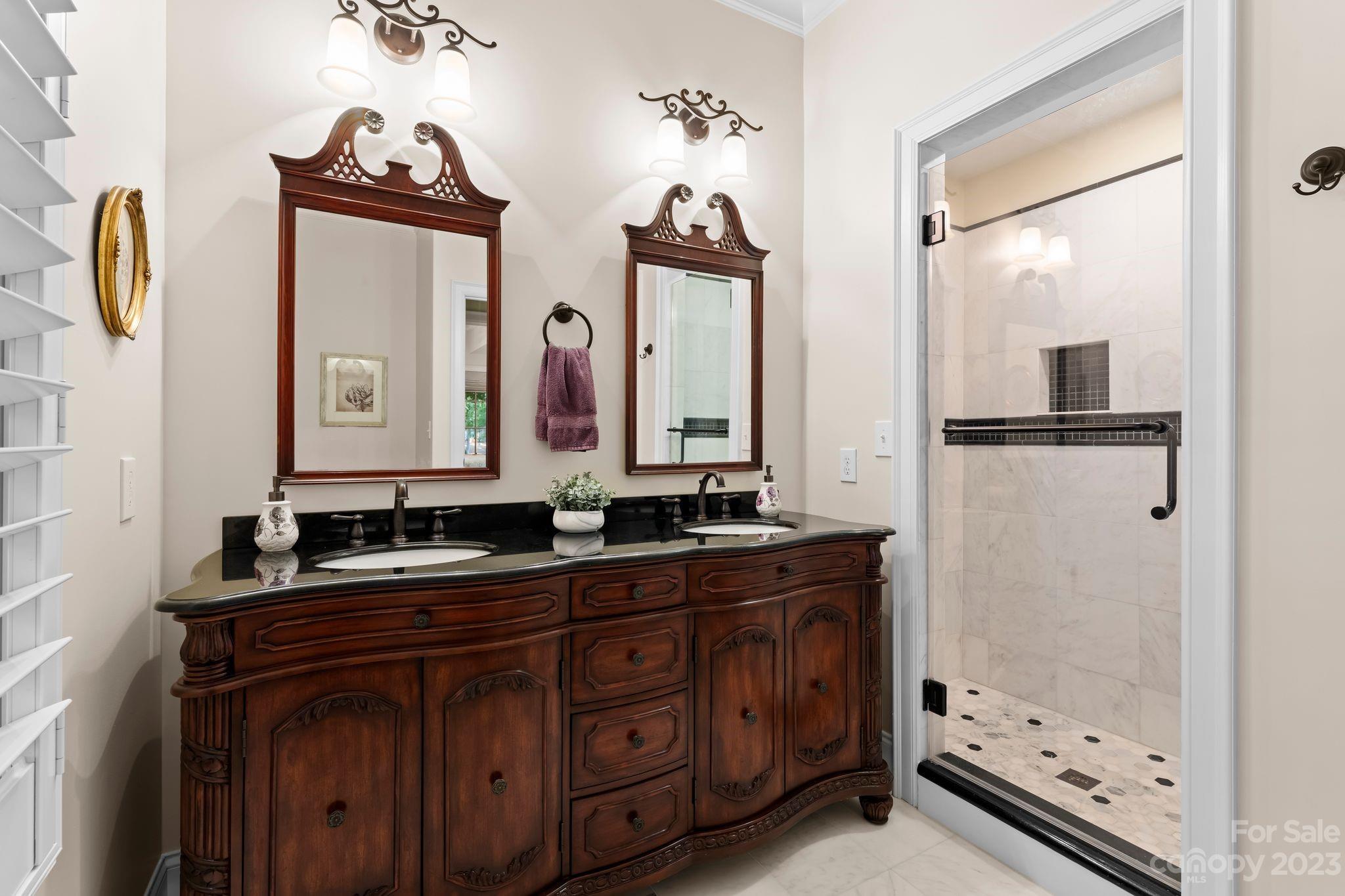 413 Bay Harbour Road Mooresville, NC 28117 - Photo 33 of 47 a bathroom with a double vanity sink and a mirror