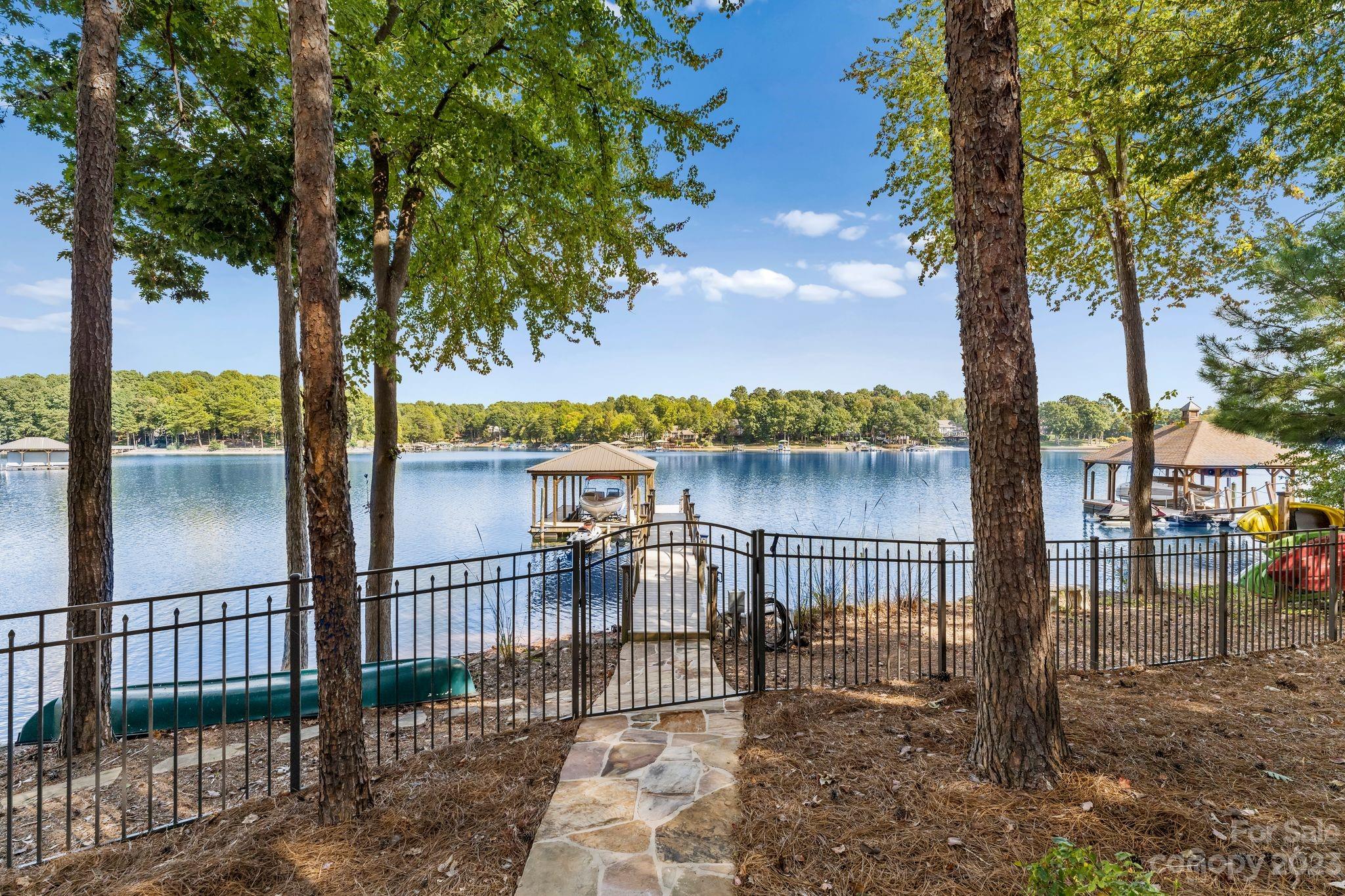 413 Bay Harbour Road Mooresville, NC 28117 - Photo 39 of 47 a view of a lake with iron fence and a trees
