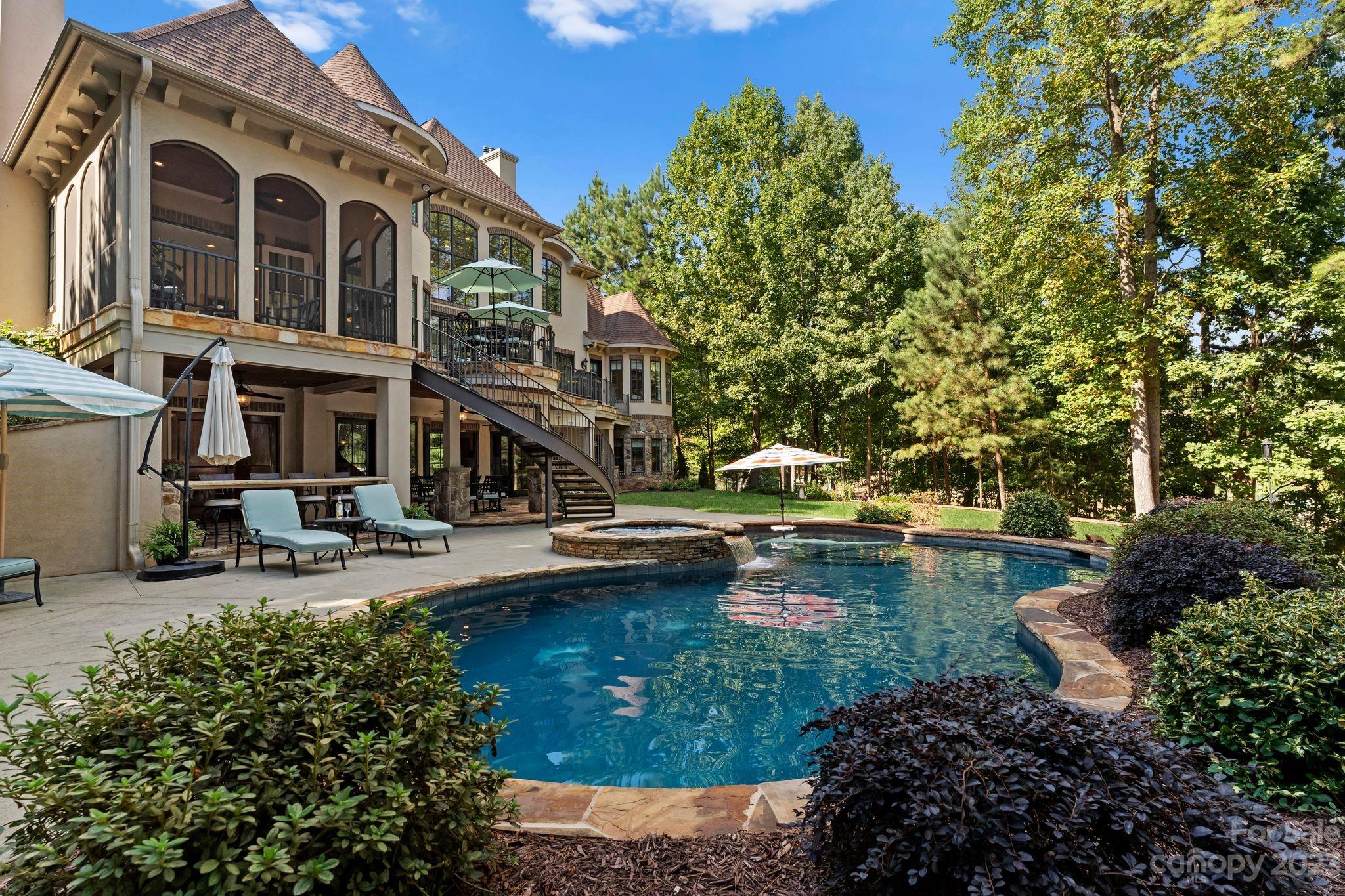 413 Bay Harbour Road Mooresville, NC 28117 - Photo 42 of 47 a view of a house with swimming pool and sitting area