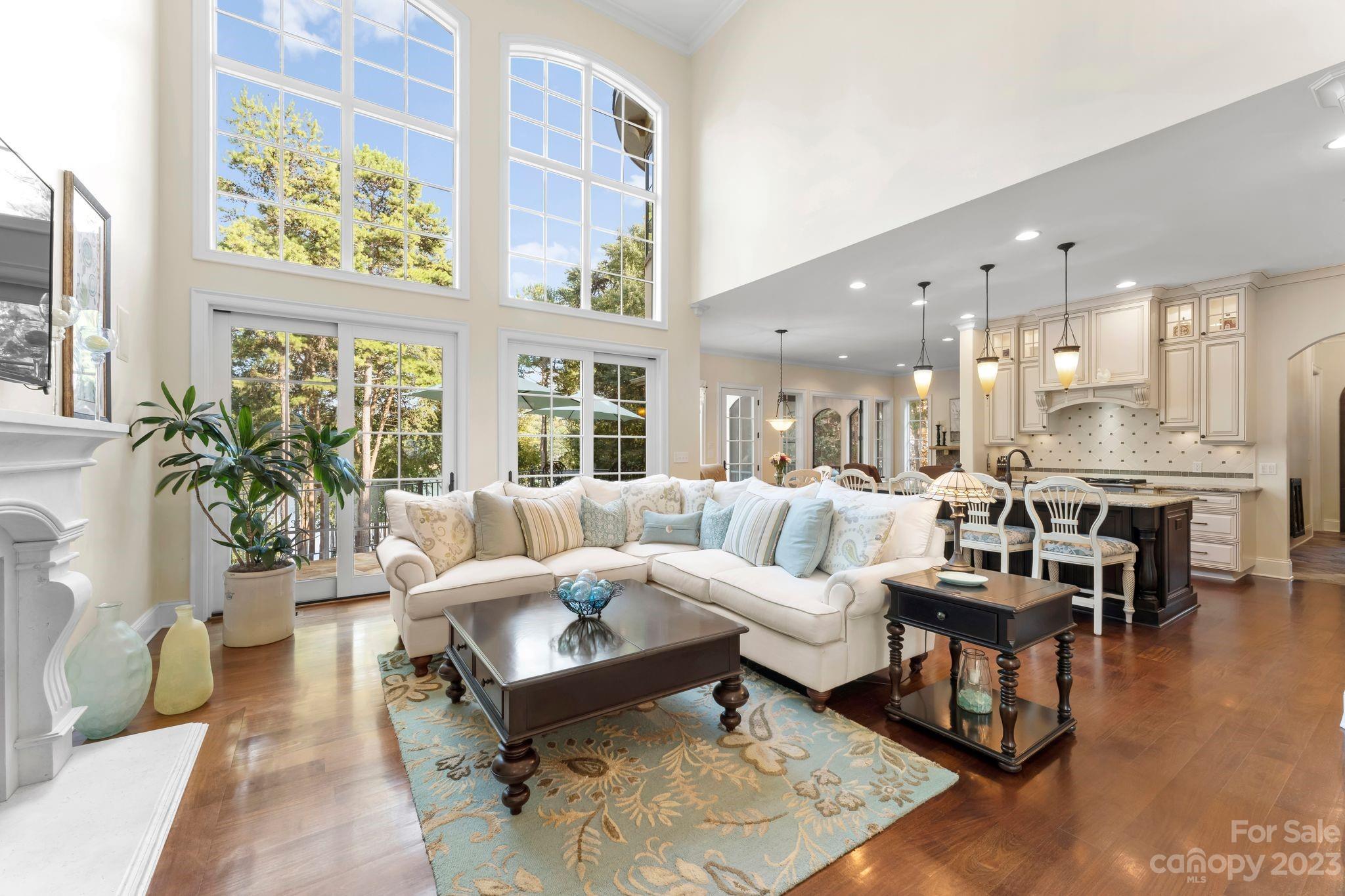 413 Bay Harbour Road Mooresville, NC 28117 - Photo 5 of 47 a living room with furniture wooden floor and a large window