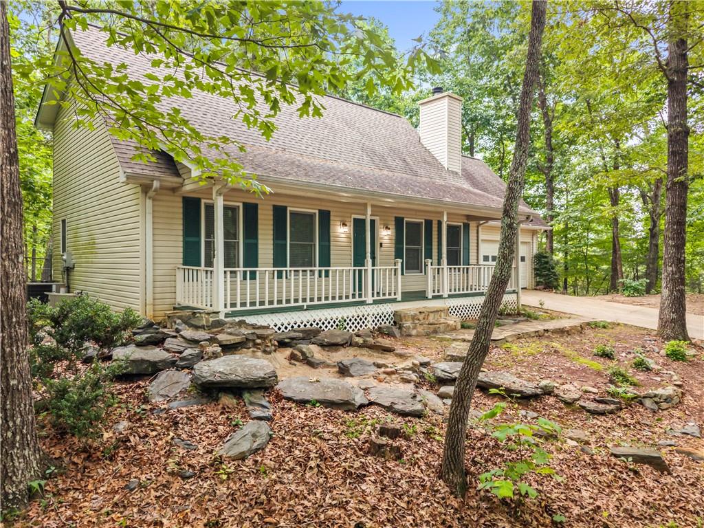 2009 Ben Higgins Road Dahlonega, GA 30533 - Photo 1 of 25 a backyard of a house with yard and outdoor seating