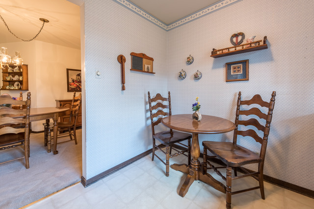 1471 Haverhill Drive, Unit B Wheaton, IL 60189 - Photo 12 of 25 a view of a dining room with furniture and a chandelier
