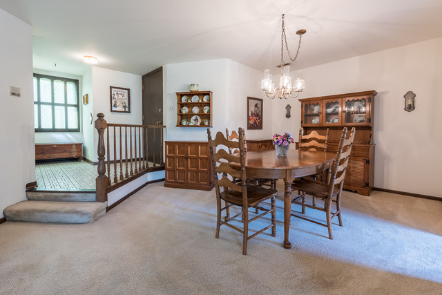 1471 Haverhill Drive, Unit B Wheaton, IL 60189 - Photo 7 of 25 a view of a livingroom with furniture and a chandelier