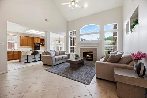 a living room with furniture and a fireplace