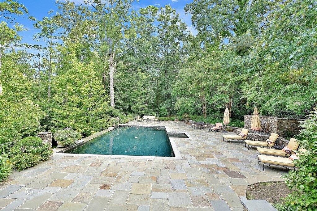 6528 Standing Boy Road Columbus, GA 31904 - Photo 18 of 44 a view of backyard with swimming pool and seating space
